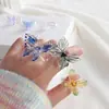 Anillo de mariposa con esmalte de color Zibo de Song Yaxuan, diseño de nicho fotográfico con degradado rojo, joyería de vidrio hecha a mano