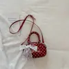 Bolso tipo almohada liso de estilo coreano casual, 2026 nuevo de moda y elegante con lunares, de alta apariencia, bolso cruzado único