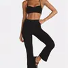 Conjunto de dos piezas para mujer estilo europeo y americano, con tirantes finos y pantalones acampanados cropped de cintura alta, sensación nude, fitness casual para correr, venta al por mayor