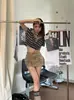 Saia de cintura alta puramente sedutora e sexy para mulheres, nova coleção outono 2026, corte justo, que valoriza a silhueta, com bolsos e um design curto, que abraça o corpo