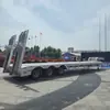 Semirremolque transfronterizo de Asia Central para transporte de ingeniería, semirremolque de plataforma baja de 3 ejes, semirremolque de plataforma plana tipo gancho de 60 toneladas
