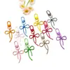 Llavero de lazo de cuentas estilo INS de colores con cinta, colgante de aleación, accesorio para niñas, charm para mochila, accesorio de hebilla para puerta