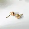 Pendientes de Joker de personalidad simple japonesa y coreana, pendientes de un solo diamante, chapados en oro de 18 quilates, pendientes de alta versión CNC seiko, venta al por mayor