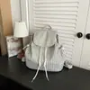 Mochila ligera INS de estilo callejero coreano, casual y elegante para mujer 2026, mochila de cuadros atmosférica para el uso diario informal y la escuela