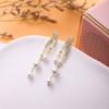 Nuevo Diseño Nicho Aretes de Borla de Perlas de Línea Cruzada de Alta Gama Aretes Elegantes de Lujo Ligero para Damas Combinan con Todo