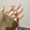NAIDU Nuevo Elegante Estilo Coreano Nuevo Producto Elegante Pequeño Dorado Reloj de Dama Estilo Femenino Nicho Más Vendido Alto Valor de Apariencia