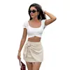 Falda ajustada transfronteriza europea y americana 2026 nuevo verano elegante accesorio metálico de cintura alta irregular ropa de mujer