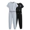 Ropa deportiva de verano ajustada de dos piezas, nueva importación transfronteriza, camiseta de manga corta y pantalones de pierna Harlan, traje deportivo para mujer, venta al por mayor