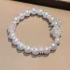 Pulsera de perlas nicho alto sentido temperamento dulce chica personalidad pulsera mayoreo 2024 nueva joyería red