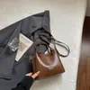 Bolsa Pequena Simples Estilo Coreano Feminina 2026 Nova Bolsa de Mão com Textura Trançada Bolsa Transversal Casual da Moda Bolsa Quadrada Pequena Tendência