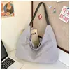 Bolso de mano simple y artístico de gran capacidad, bolso de axila de comercio exterior moderno y único, bolso de hombro a rayas casual de nailon a la moda