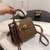 Bolsa de Mão de Nicho Transfronteiriço em Couro Macio Feminina 2025 Novo Estilo Simples Retrô Bolsa de Ombro Versátil Transversal Bolsa Kelly