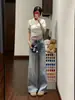 Jeans Americanos Azul Claro Lavados Micro-Flare para Mujer Otoño 2026 Estilo Nuevo No Ajustados a las Piernas Buena Caída Pantalones de Campana de Cintura Alta