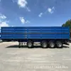 Ventas transfronterizas semirremolque de transporte a granel de grano de 4 ejes volquete lateral para volquete de transporte de arena y grava carbón