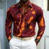 Nueva camisa de manga larga para hombre con base azul y estampado de salpicaduras naranja-amarillas, diseño audaz y llamativo, versátil para ir al trabajo