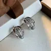 Nuevos Pendientes de Clip Metálico de Zirconia para Oreja con Bobina de Mosquito Pendientes Únicos de Estilo Europeo y Americano Simples Elegantes de Gama Alta