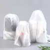 Bolsa con cordón esmerilado para ropa infantil, calcetines de plástico con cordón, bolsa de embalaje transparente para mudanzas, bolsa de almacenamiento de viaje a prueba de polvo para ropa