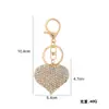 Venta caliente llavero colgante de amor con diamantes completos adornos para bolso exquisitos pequeños regalos joyería colgante de personalidad para coche venta al por mayor