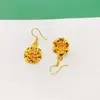 Suministro en vivo cobre bañado en oro moda color nacional flor Tianxiang gancho pendientes pendientes viento frío fábrica venta al por mayor