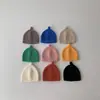 Gorro de lana cálido para bebé estilo coreano ins color liso otoño e invierno para niños y niñas simple versátil gorro para el frío