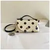 Bolsa Lonchera de Lunares Estilo Francés para Mujer 2026 Nuevo Modelo Bolso de Mano Texturizado para el Trabajo Moda de Nicho Elegante Bolso de Hombro Cruzado