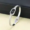 Pulsera estilo reloj vintage, Pulsera con esfera ovalada de cuarzo en forma de serpiente, Pulsera de acero inoxidable hueca con números romanos