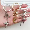 Llavero Popular de Cuatro Puntas Cruz Estrella Luna Transfronterizo Moda Colgante Decoración Simple para Bolso Amazon