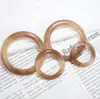 Botón frontal amarillo resina convexa imitación Ámbar anillo decorativo anillo accesorios de traje de baño aretes de joyería DIY