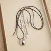 Collar minimalista de cordón negro con colgante de gota de agua ovalada cepillada para mujer, estilo coreano, cadena larga ajustable para suéter, accesorio elegante y versátil