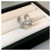 Estilo indiferente europeo y americano tejido de punto trenzado ear cuff simple luz de lujo diseño de nicho aretes moda de alta gama joyería de oído versátil