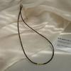 Otoño e Invierno 2 mm Corte Extremadamente Fino Ojo de Tigre Natural Plata Rota Dorada Collar de Plata de Ley 925 Joyería de Nicho de Lujo Ligero para Mujer