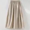 Saia Midi Floral Evasê com Cintura Elástica Feminina 2026 Primavera Nova Estilo Francês Hepburn Versátil Saia Preta Pequena