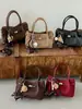Bolso modelo nuevo 2026 transfronterizo, bolso de mano simple estilo coreano, bolso tipo cubo de moda de gran capacidad, bolso cruzado casual para el día a día