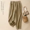 Foto real de la colección otoño/verano 2026: cintura elástica, adelgazante, versátil, corte holgado, moderno, pantalones harén de color liso para mujer