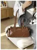 Bolso de bolos de temperamento de moda nicho para mujer, nuevo bolso casual de almohada con temperamento, bolso de hombro único retro diario para el sobaco