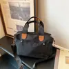 Bolsa transversal de grande capacidade para ir ao trabalho, bolsa tote casual feminina nova e moderna 2026, bolsa de mão em tecido de nylon
