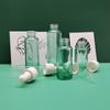 En stock 10 ml 20 ml 30 ml 40 ml Botella de aceite esencial transparente de hombro plano Botella de vidrio Botella de gotero Botella de esencia embotellada