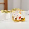 Enfeites de mesa preenchidos com óleo gato da sorte de areia movediça dourada chaveiro de acrílico criativo pingente de bolsa pequenos presentes atacado