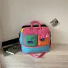 Nueva bolsa de viaje para viajes cortos, una bolsa de yoga niche y ligera, una bolsa deportiva y de fitness cruzada de un solo hombro, y una bolsa de equipaje de almacenamiento con bloques de color