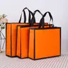 Bolsa Não Tecida Laminada Espessa Personalizada Grande Capacidade Durável Resistente ao Desgaste Transfronteiriça Fundo Reforçado Lateral Reforçada Bolsa de Presente Não Tecida