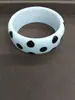 Pulsera redonda de resina con lunares transfronteriza europea y americana, diseño de nicho a la moda, sensación de alta gama, accesorio de mano simple y versátil