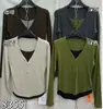 Popular estilo explosivo de este año Ropa de mujer Otoño/Invierno 2026 Nuevo Falso Dos Piezas Bloque de Color Cuello en V Manga Larga Camiseta Capa Base Top