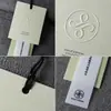 Etiqueta a prueba de manipulaciones con logo personalizado, etiqueta para tienda de ropa, papel especial, etiqueta de ropa de estilo simple, hecha a medida