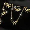 Conjunto de Quatro Peças Elegante e Versátil de Colar, Pulseira, Brincos e Anel com Laço para Mulheres, Conjunto de Joias Moderno e de Alta Qualidade