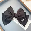 Clip de resorte con lazo de perla, accesorio para el cabello de alta gama, elegante y francés para celebridades de Internet.