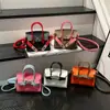 Otoño 2026 Nuevo Mini de Alto Valor Moderno Sencillo Elegante Temperamento Versátil Bolso Kelly de un Hombro Cruzado de Mano