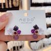 Pendientes de flor pequeña de cristal morado, diseño de nicho femenino, elegantes pendientes de celebridades de Internet, nuevos pendientes de aguja de plata de moda 2023