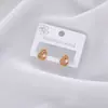 Os novos brincos de pérola estilo Hong Kong da Amazon são de luxo leve, modernos, simples, versáteis e adequados para um look de férias fresco e casual para mulheres.