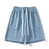 Bolsillo grande estilo japonés de verano cintura elástica alta pantalones cortos holgados texturizados con cordón transpirables deportivos casuales para hombre