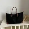Bolsa Casual Estilo Coreano 2026 Otoño Versión Coreana Estampado de Leopardo Retro Gran Capacidad Tote Moda para el Trabajo y el Viaje Bolso de Hombro Único